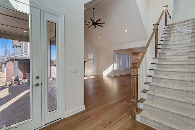 2540 Edgewood Trce, Pepper Pike, OH 44124 - foyer with high vaulted ceiling, wood finished floors, stairway, baseboards, and ceiling fan