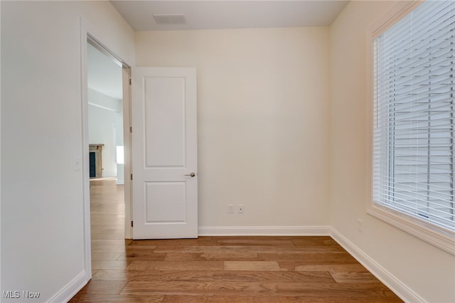 2540 Edgewood Trce, Pepper Pike, OH 44124 - empty room featuring wood finished floors, baseboards, and a fireplace