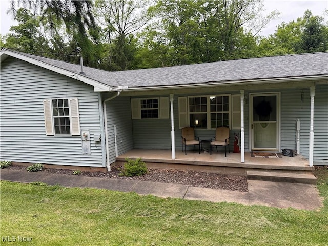 645 Arends Ridge Rd, Marietta, OH 45750 - back of property featuring a porch, a lawn, and a shingled roof