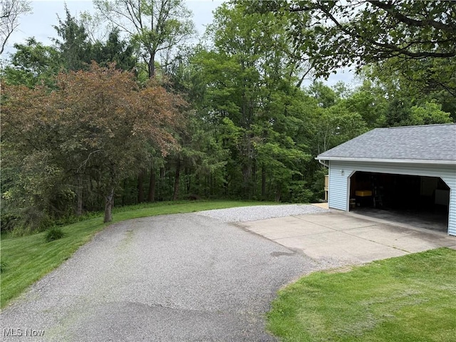 645 Arends Ridge Rd, Marietta, OH 45750 - detached garage featuring a view of trees