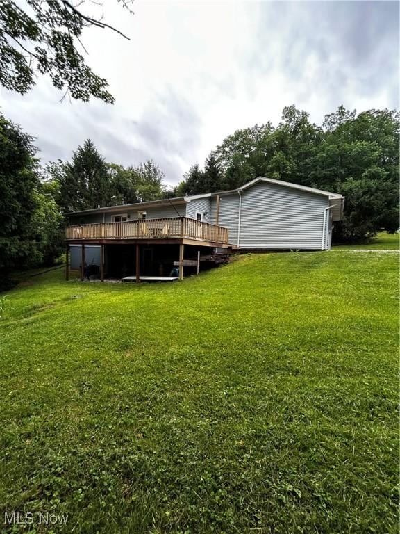 645 Arends Ridge Rd, Marietta, OH 45750 - rear view of house featuring a wooden deck and a lawn