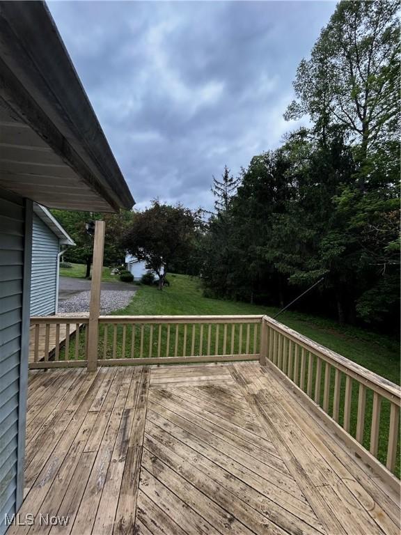 645 Arends Ridge Rd, Marietta, OH 45750 - wooden deck featuring a lawn