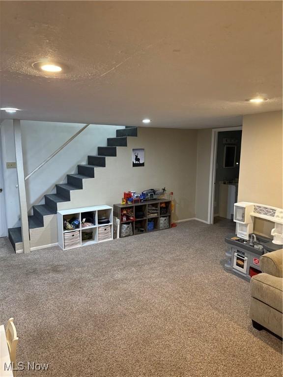 645 Arends Ridge Rd, Marietta, OH 45750 - finished below grade area with stairs, carpet floors, recessed lighting, and baseboards