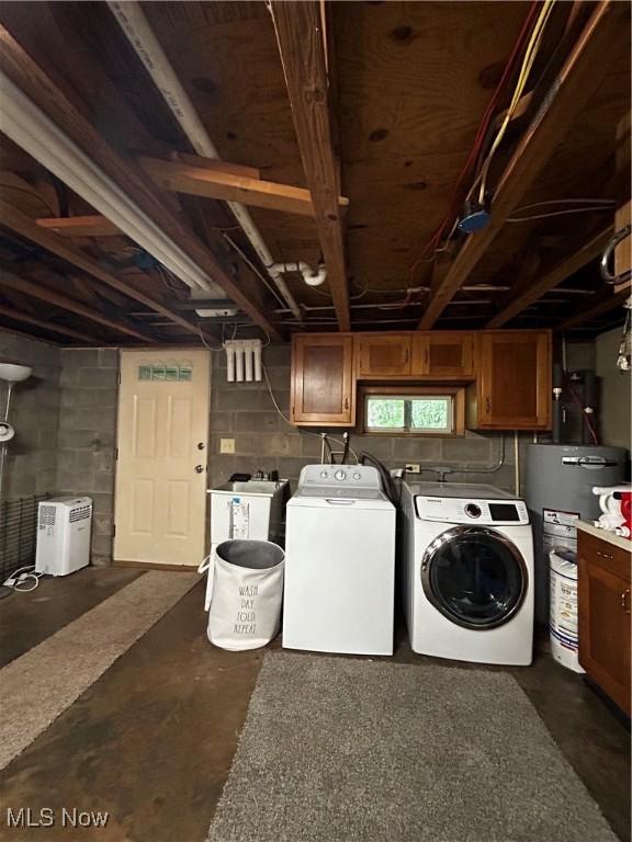 645 Arends Ridge Rd, Marietta, OH 45750 - laundry room with cabinet space, separate washer and dryer, water heater, and concrete block wall