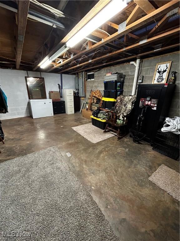 645 Arends Ridge Rd, Marietta, OH 45750 - unfinished basement featuring concrete block wall and electric panel