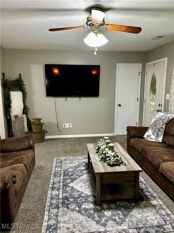 645 Arends Ridge Rd, Marietta, OH 45750 - carpeted living room with a ceiling fan and baseboards