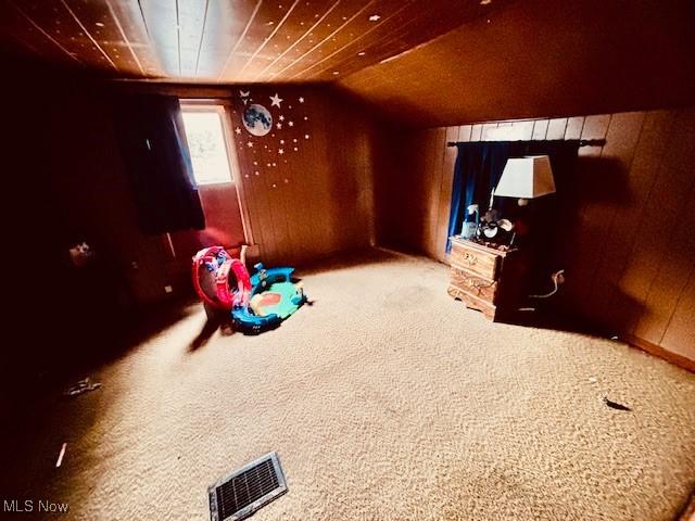 1445 E County Line Rd, Mineral Ridge, OH 44440 - recreation room featuring wood walls, carpet flooring, and lofted ceiling