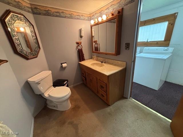 1445 E County Line Rd, Mineral Ridge, OH 44440 - bathroom featuring washer / dryer, toilet, and vanity