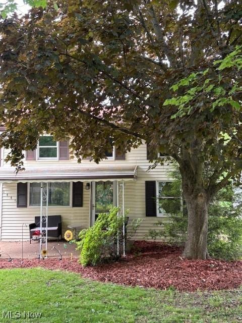 1445 E County Line Rd, Mineral Ridge, OH 44440 - view of property hidden behind natural elements with a patio