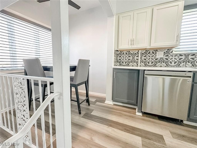226 Cunningham Ln, Steubenville, OH 43952 - bar with dishwasher, light wood-type flooring, ceiling fan, and baseboards