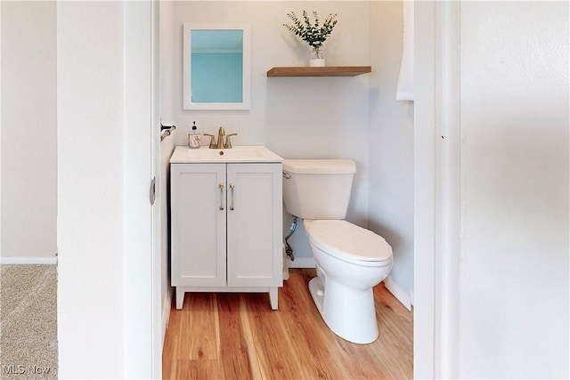 226 Cunningham Ln, Steubenville, OH 43952 - half bathroom with toilet, vanity, baseboards, and wood finished floors