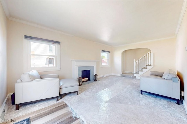 226 Cunningham Ln, Steubenville, OH 43952 - living area with arched walkways, ornamental molding, a fireplace with flush hearth, and baseboards