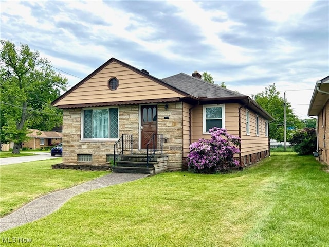 1613 Wexford Ave, Parma, OH 44134 - bungalow with stone siding, a front lawn, a chimney, and a shingled roof