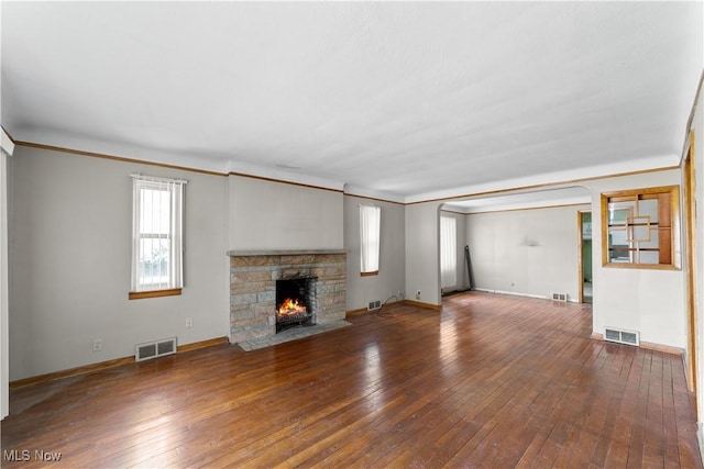 1613 Wexford Ave, Parma, OH 44134 - unfurnished living room with crown molding, hardwood / wood-style floors, a fireplace, and baseboards