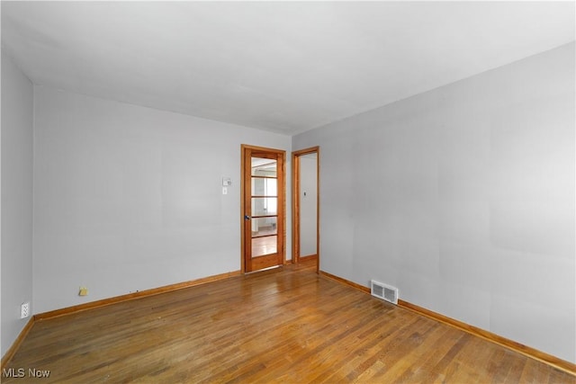 1613 Wexford Ave, Parma, OH 44134 - empty room featuring wood finished floors and baseboards