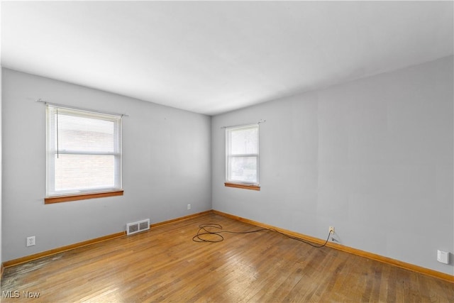 1613 Wexford Ave, Parma, OH 44134 - unfurnished room featuring wood finished floors and baseboards
