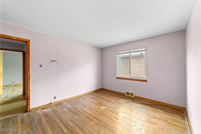 1613 Wexford Ave, Parma, OH 44134 - empty room featuring wood finished floors and baseboards