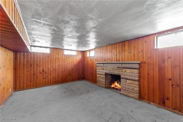 1613 Wexford Ave, Parma, OH 44134 - basement with plenty of natural light, a stone fireplace, and wooden walls