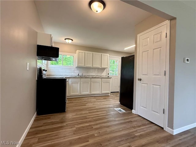 356 N Edgehill Ave, Austintown, OH 44515 - kitchen with range with electric cooktop, baseboards, white cabinets, decorative backsplash, and freestanding refrigerator