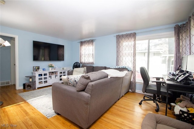 2464 Lyon Blvd, Poland, OH 44514 - living room featuring an office area, light wood-style floors, and baseboards