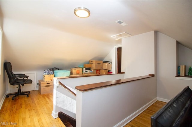 2464 Lyon Blvd, Poland, OH 44514 - additional living space featuring light wood-style flooring, vaulted ceiling, and baseboards