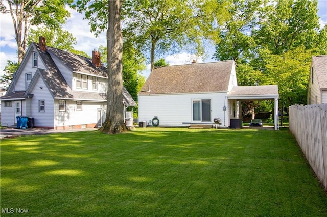 2464 Lyon Blvd, Poland, OH 44514 - rear view of house with a chimney, central AC unit, and entry steps