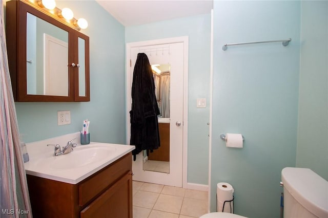 2464 Lyon Blvd, Poland, OH 44514 - bathroom with toilet, vanity, and tile patterned flooring