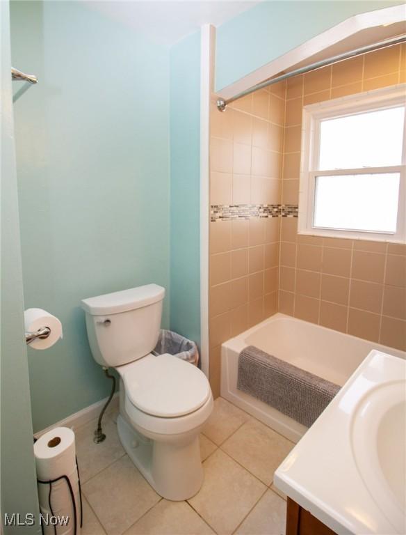 2464 Lyon Blvd, Poland, OH 44514 - bathroom featuring toilet, vanity, tile patterned flooring, and bathing tub / shower combination