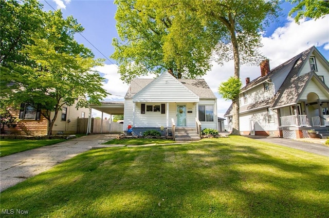 2464 Lyon Blvd, Poland, OH 44514 - bungalow with a porch, driveway, and a carport