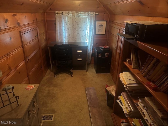 12704 Oak Park Blvd, Garfield Heights, OH 44125 - home office featuring light colored carpet, lofted ceiling, a decorative wall, and wooden walls
