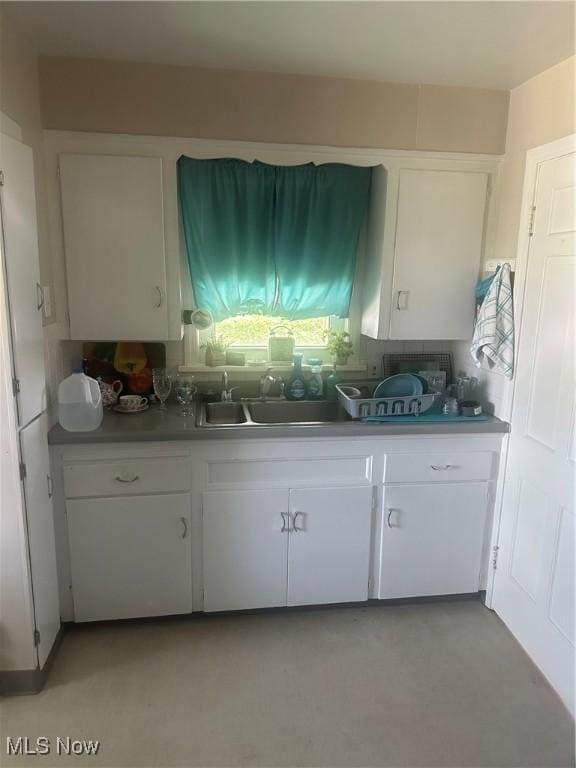 12704 Oak Park Blvd, Garfield Heights, OH 44125 - kitchen with a sink and white cabinetry