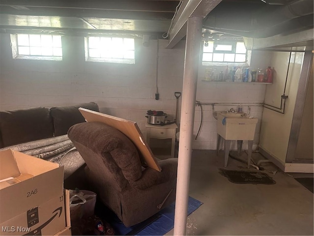 12704 Oak Park Blvd, Garfield Heights, OH 44125 - basement featuring plenty of natural light and concrete block wall