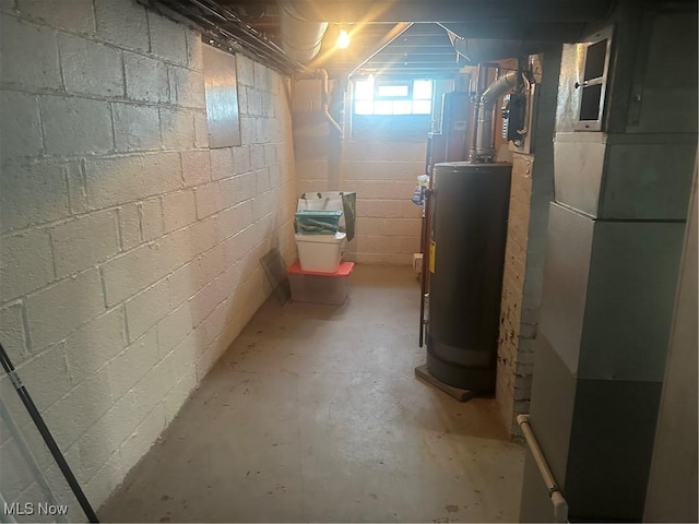 12704 Oak Park Blvd, Garfield Heights, OH 44125 - basement featuring gas water heater, heating unit, and concrete block wall