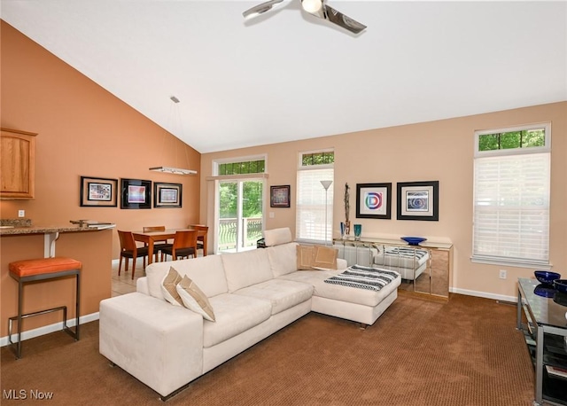 9339 Sasha Ct, Twinsburg, OH 44087 - living area featuring ceiling fan, baseboards, high vaulted ceiling, and dark carpet