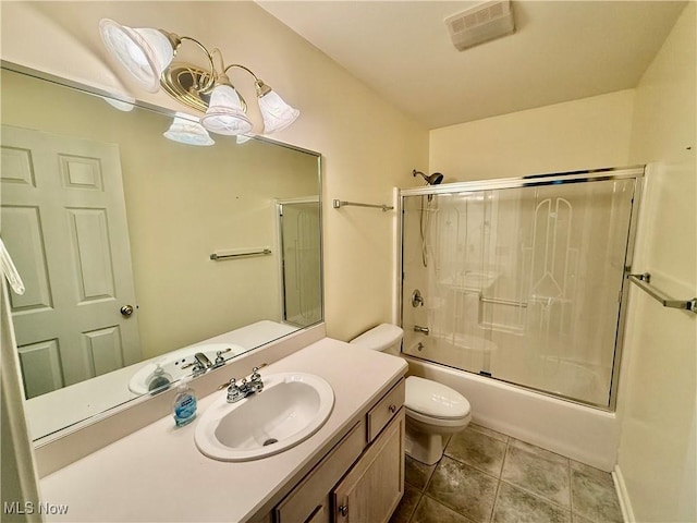 5228 Nashua Dr, Austintown, OH 44515 - bathroom featuring toilet, vanity, enclosed tub / shower combo, and tile patterned flooring