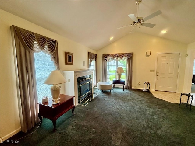 5228 Nashua Dr, Austintown, OH 44515 - carpeted living area featuring a premium fireplace, vaulted ceiling, baseboards, and a ceiling fan