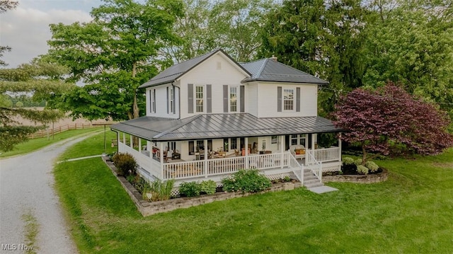 2953 State Route 225, Diamond, OH 44412 - farmhouse with metal roof, a porch, a standing seam roof, and a front lawn