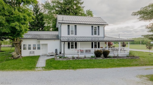 2953 State Route 225, Diamond, OH 44412 - farmhouse-style home featuring a standing seam roof, a porch, metal roof, and a front lawn