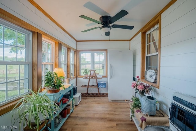 2953 State Route 225, Diamond, OH 44412 - sunroom with heating unit, ornamental molding, wood finished floors, and plenty of natural light