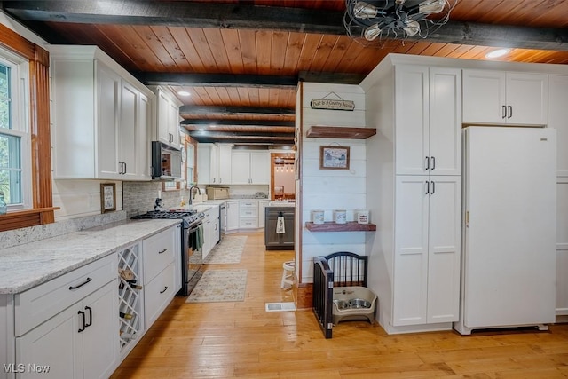 2953 State Route 225, Diamond, OH 44412 - kitchen featuring freestanding refrigerator, stainless steel range with gas stovetop, wood ceiling with exposed beams, white cabinets, and light wood-style flooring
