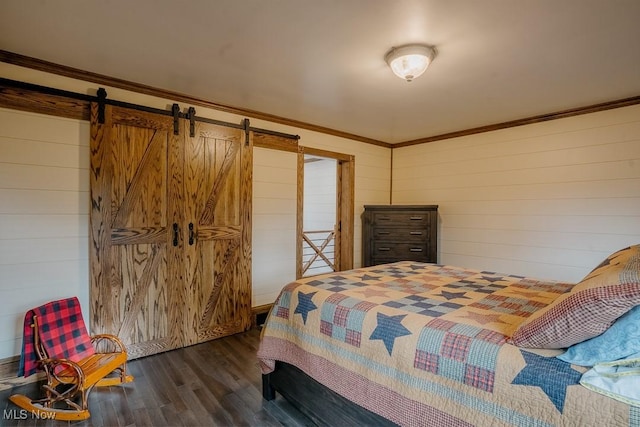 2953 State Route 225, Diamond, OH 44412 - bedroom with dark wood-style flooring, wooden walls, ornamental molding, and a barn door