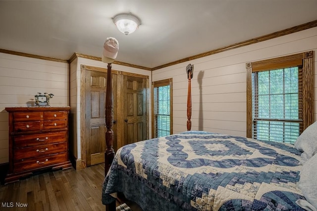 2953 State Route 225, Diamond, OH 44412 - bedroom with wood walls, multiple windows, dark wood-style flooring, and ornamental molding