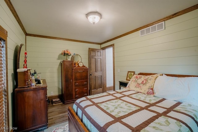 2953 State Route 225, Diamond, OH 44412 - bedroom with crown molding, wood finished floors, and wooden walls