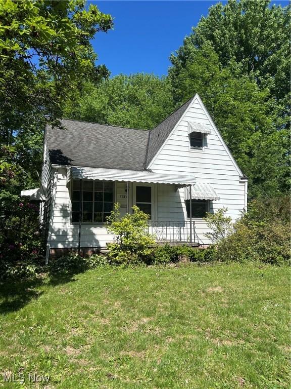 7354 Hopkins Rd, Mentor, OH 44060 - view of front facade featuring a front lawn and covered porch