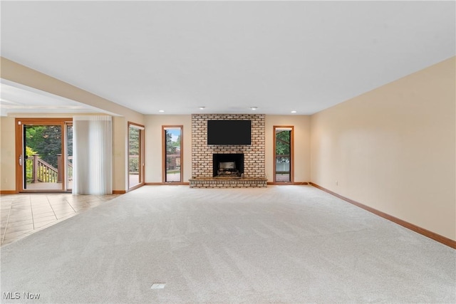 3751 Muirfield Dr, Uniontown, OH 44685 - unfurnished living room featuring carpet floors, baseboards, a fireplace, and recessed lighting