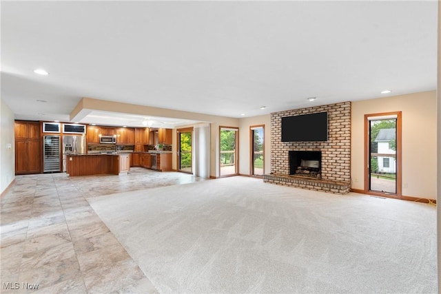 3751 Muirfield Dr, Uniontown, OH 44685 - unfurnished living room with a fireplace, recessed lighting, baseboards, and light marble finish floors