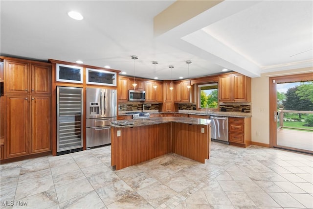 3751 Muirfield Dr, Uniontown, OH 44685 - kitchen with appliances with stainless steel finishes, beverage cooler, a kitchen island, recessed lighting, and decorative backsplash