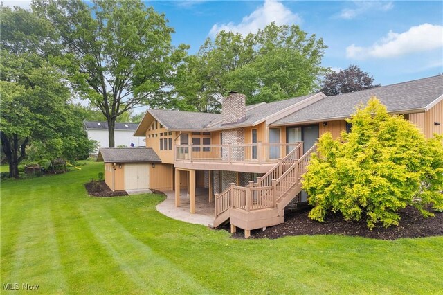 3751 Muirfield Dr, Uniontown, OH 44685 - rear view of property featuring a chimney, a deck, stairway, a lawn, and a shingled roof