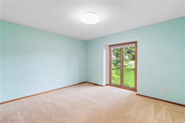3751 Muirfield Dr, Uniontown, OH 44685 - carpeted empty room featuring baseboards
