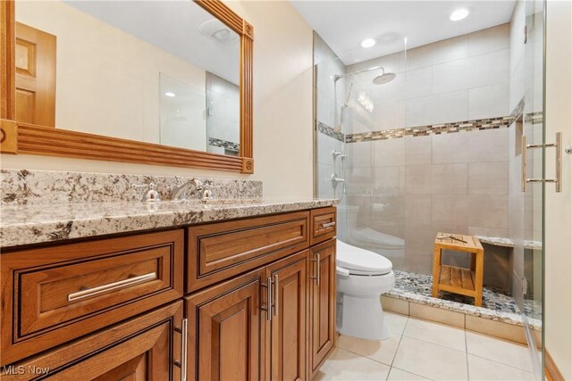 3751 Muirfield Dr, Uniontown, OH 44685 - bathroom with toilet, tile patterned floors, vanity, a stall shower, and recessed lighting